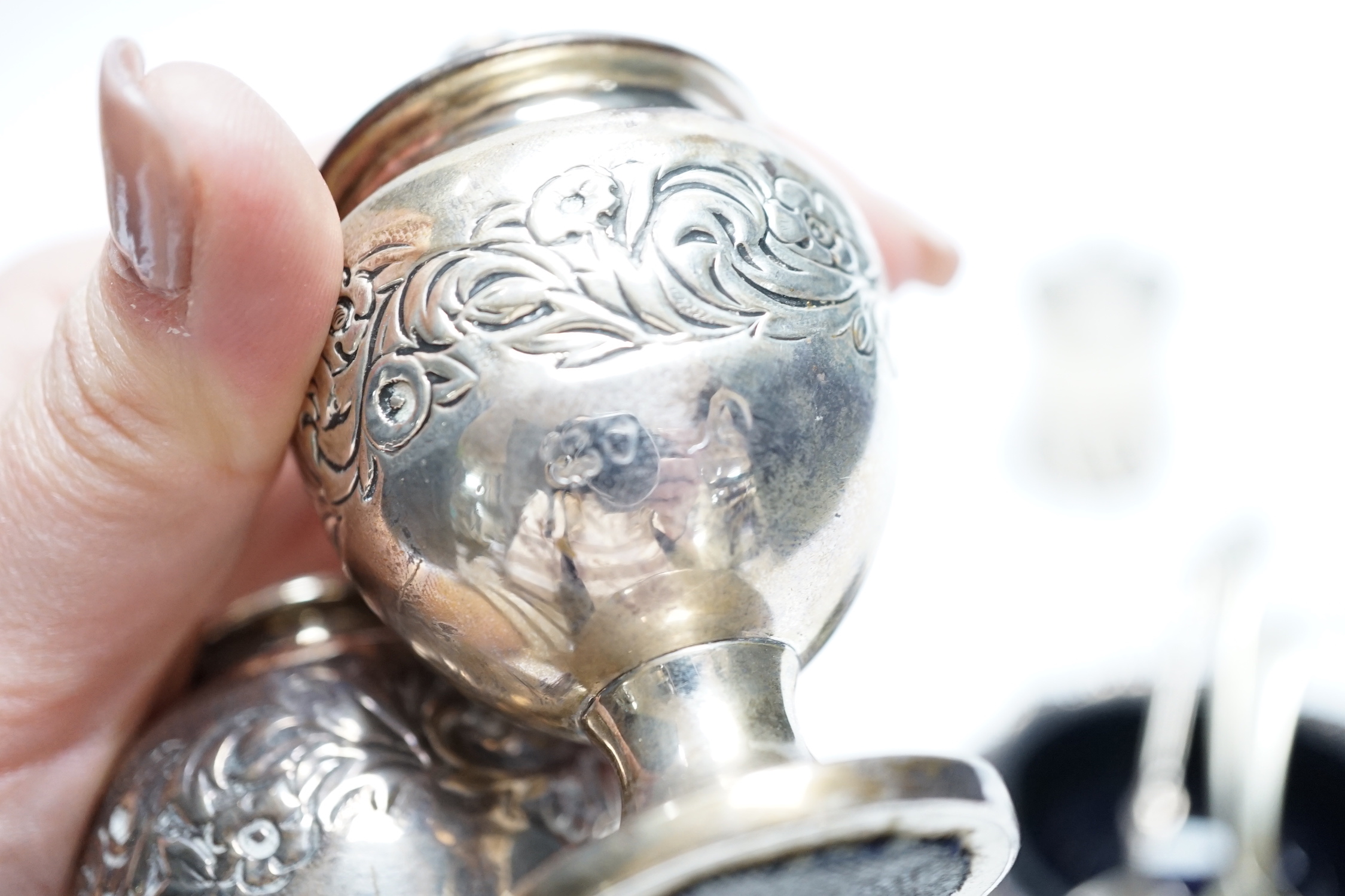 Two Georgian silver bun salts and three other silver condiments.